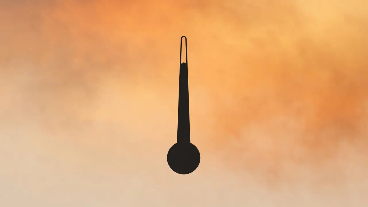 A thermometer silhouetted against a hazy orange sky, symbolizing extreme global heat.